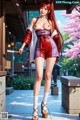 A woman in a red and purple outfit holds a sword, standing outdoors with cherry blossoms.